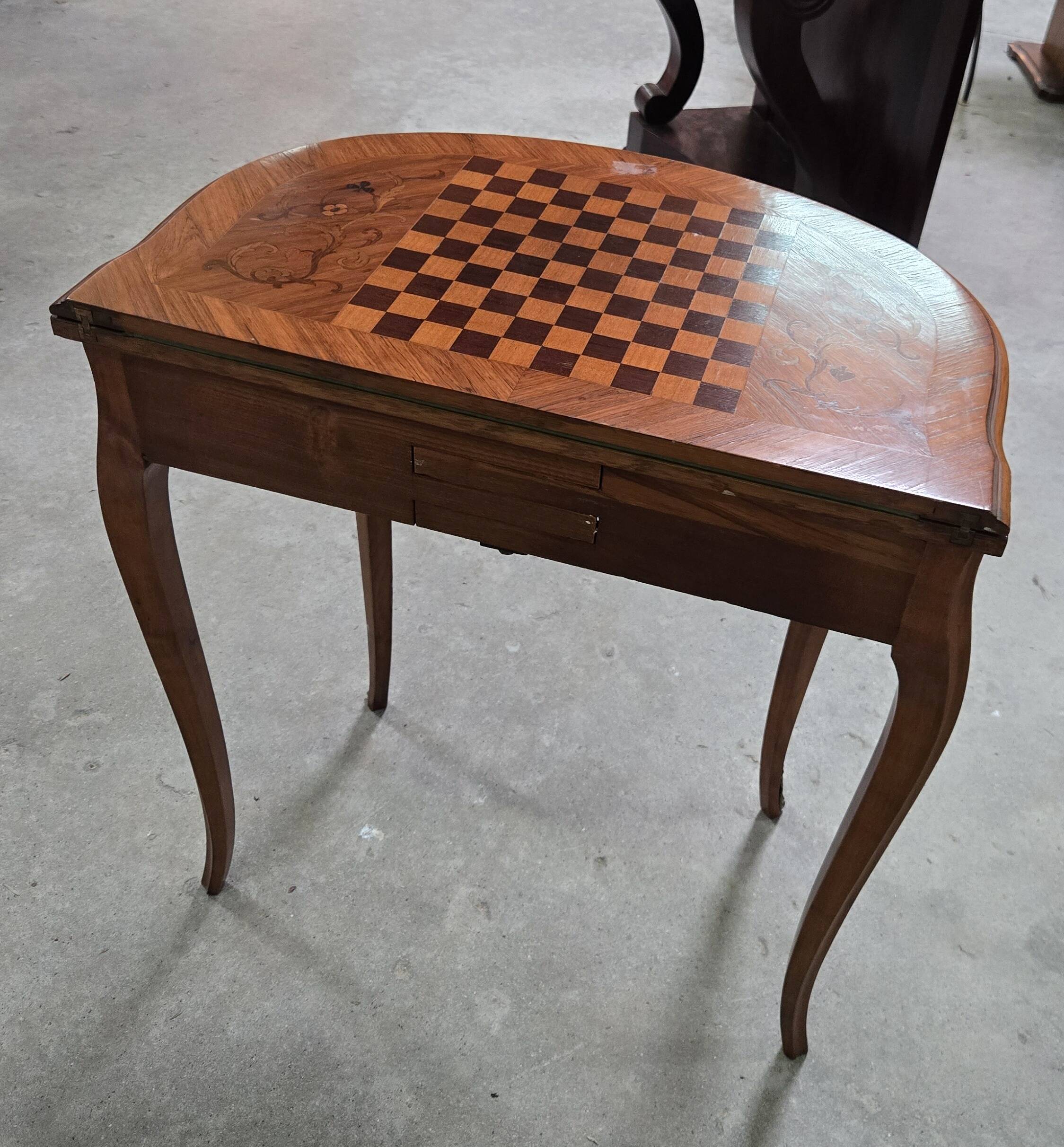 Half-moon gaming table in Louis XV style, made of precious wood marquetry.