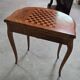 Half-moon gaming table in Louis XV style, made of precious wood marquetry.