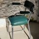 Pair of green vinyl and chrome armchairs, mid-century
