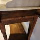 Dressing table in oak wood with a slightly veined white marble top.
