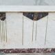 Central island shop counter in marble and oak, Art Deco period.