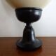 Ostrich egg on blackened wooden base - object of curiosity