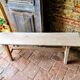 Rustic, raw solid oak bench.