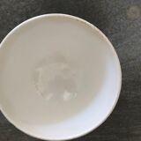 Old bowl decorated with a farmer and her cow