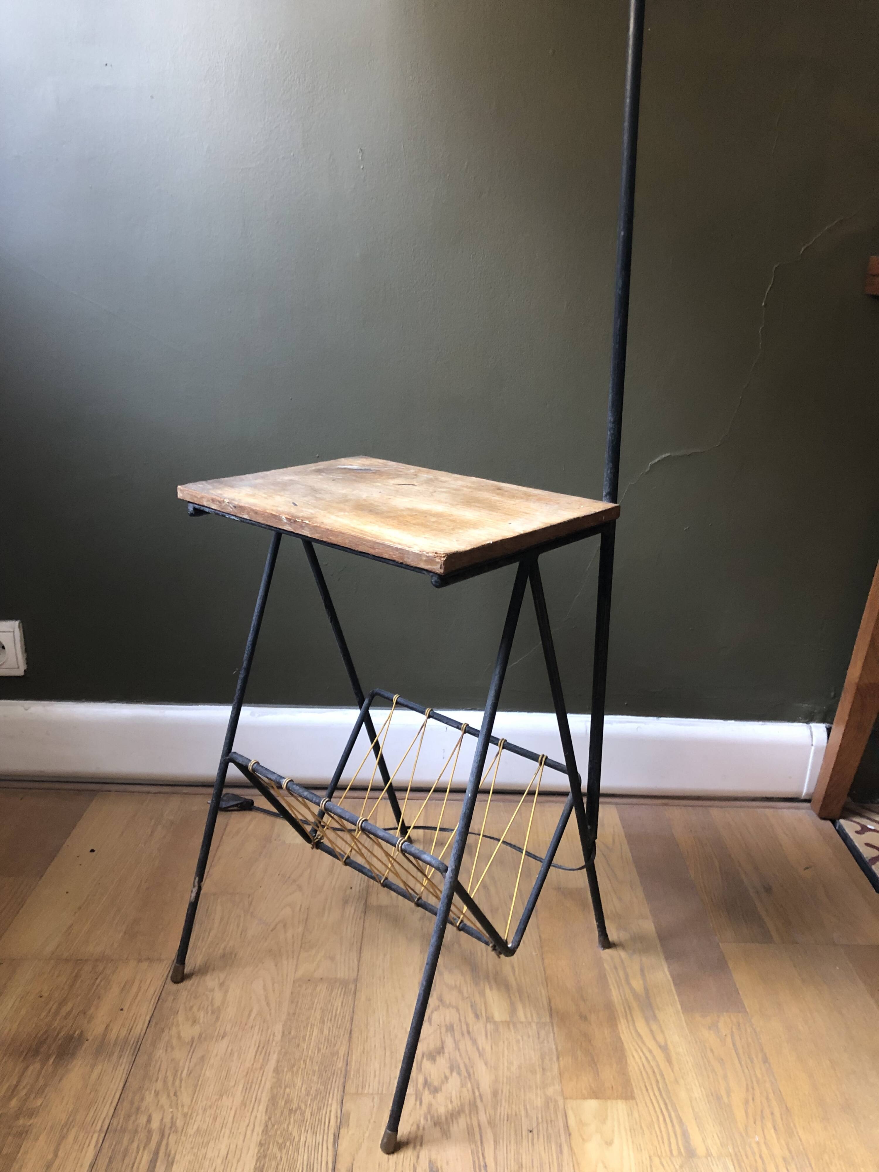 Modernist floor lamp with shelf and magazine holder.