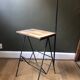 Modernist floor lamp with shelf and magazine holder.