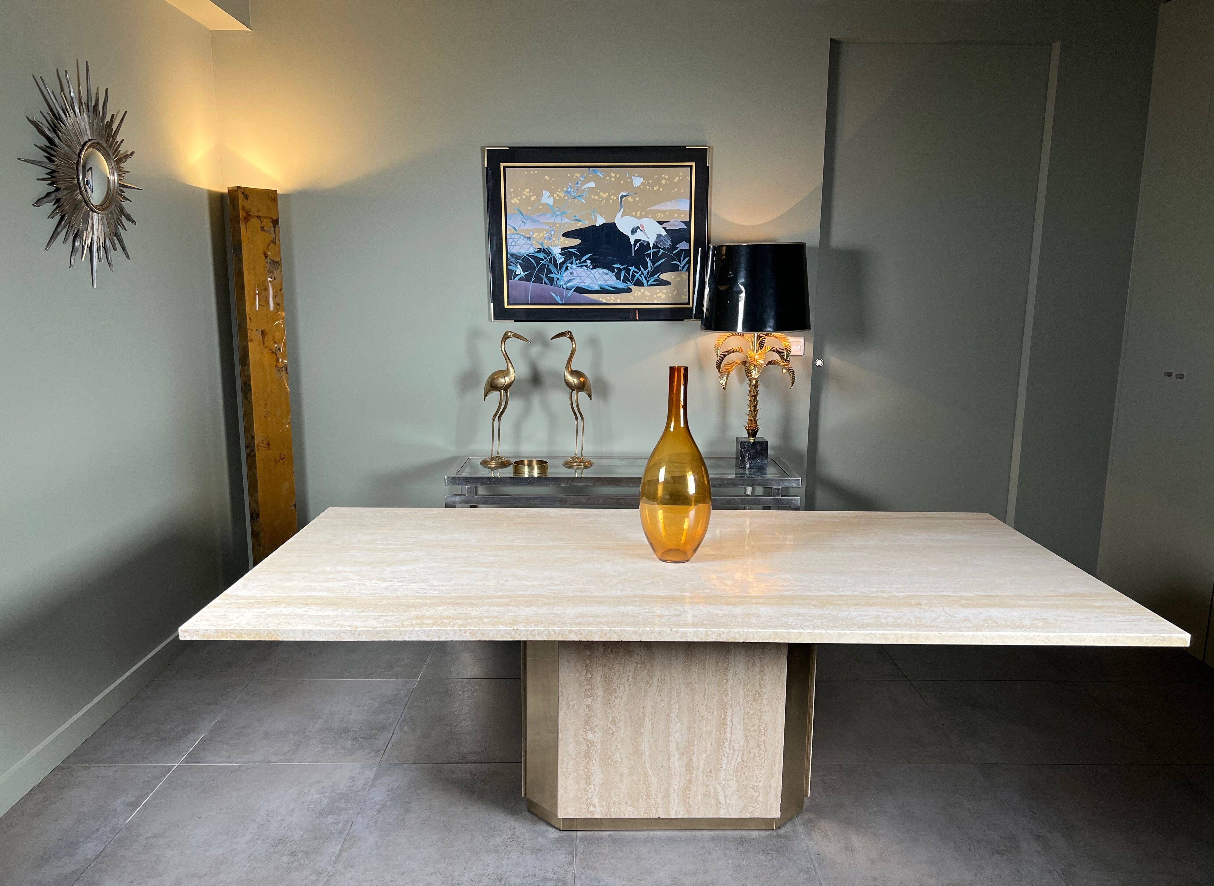 Dining table in travertine and brass. French work. Around 1970.
