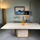 Dining table in travertine and brass. French work. Around 1970.