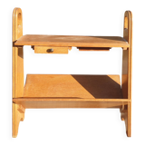 Magazine rack with sliding drawers in light wood, Scandinavian style.