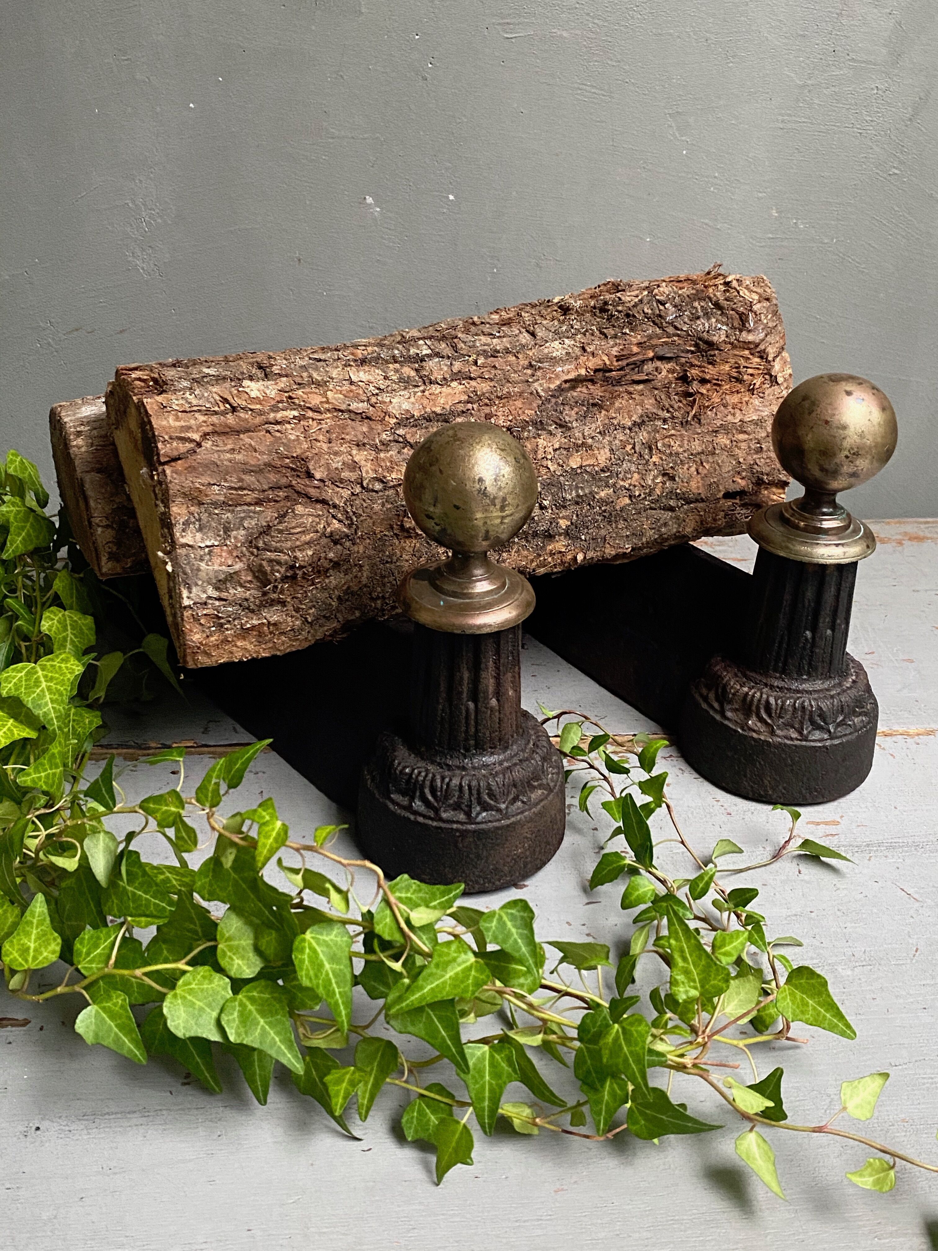 Pair of brass and cast iron ball pegs