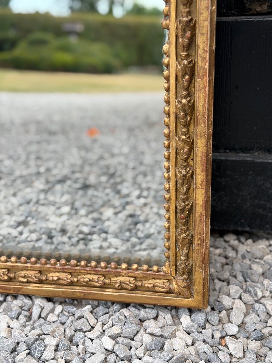 Louis XVI mirror in carved and gilded wood, 18th century