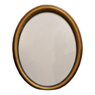 Golden oval frame