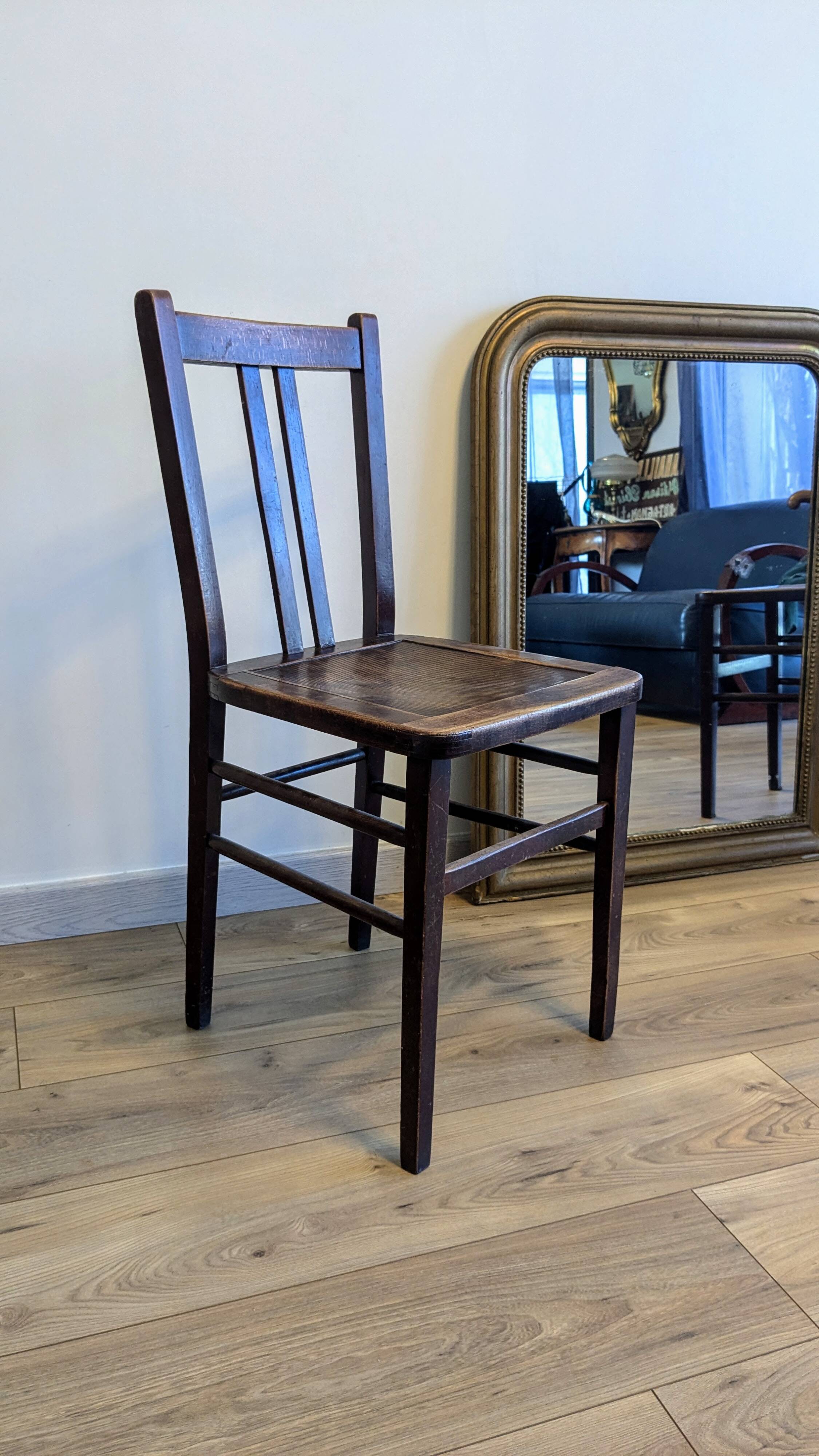 Pair of 1930s bistro chairs with patinated wood.