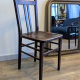 Pair of 1930s bistro chairs with patinated wood.