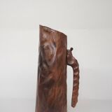 carved wooden pitcher