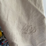 Large white cotton tea towel with damask thread.