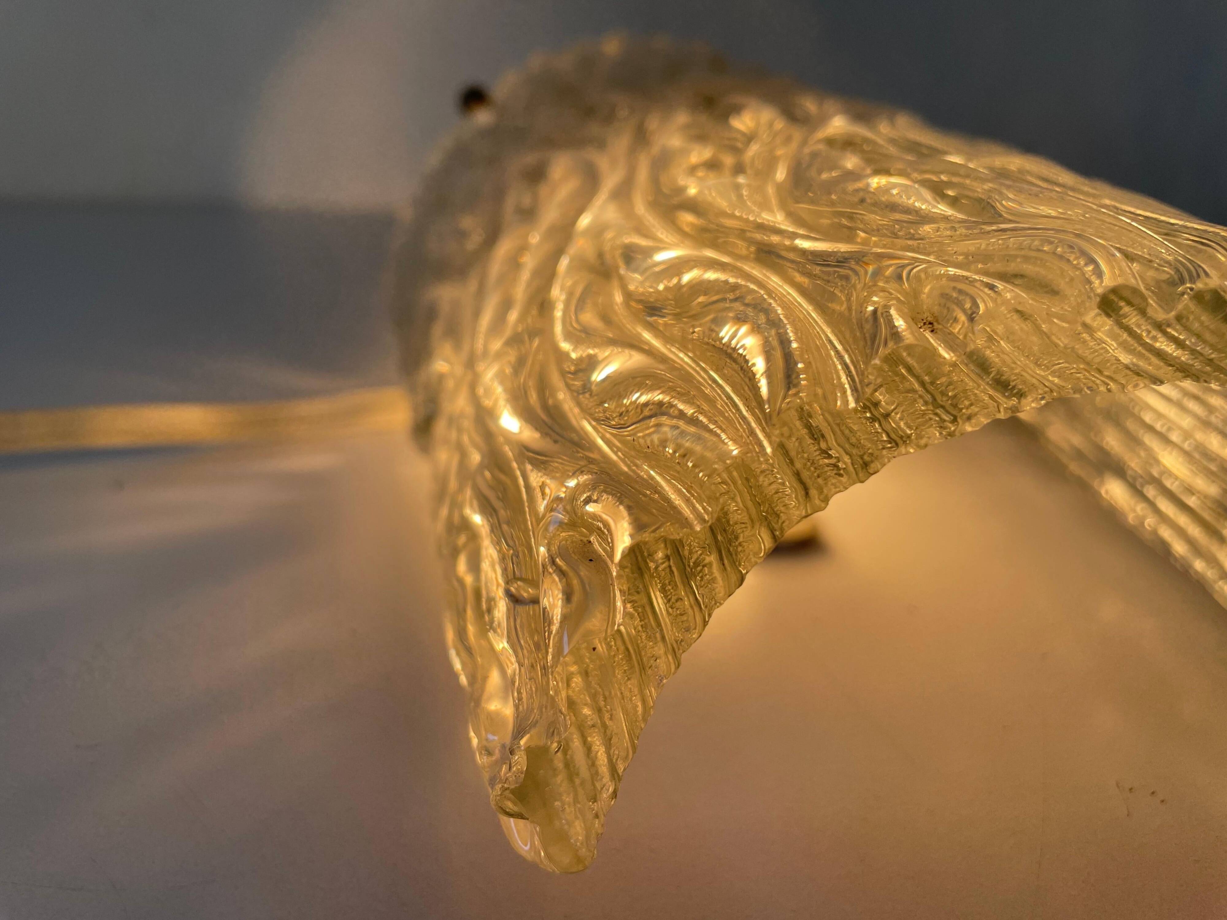 Simple arch-shaped wall light in textured glass, 1950s, Germany.