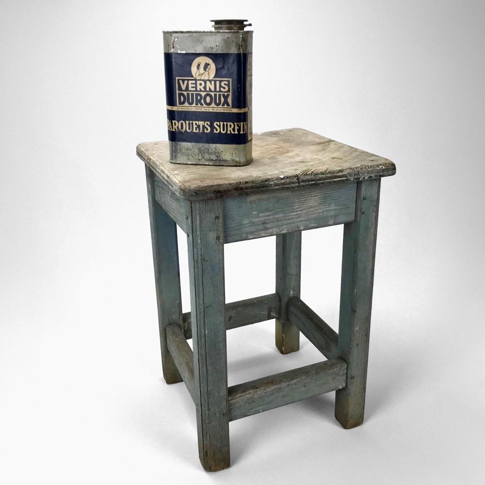 Blue-tinted wooden workshop stool