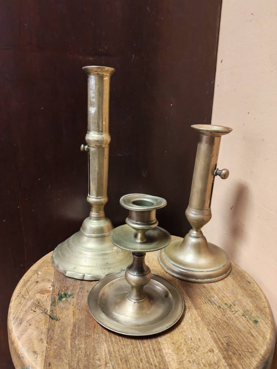 Set of three solid brass candle holders