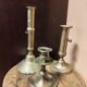 Set of three solid brass candle holders