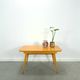 Vintage veneer table with pretty angular legs and brass at the base of the legs.