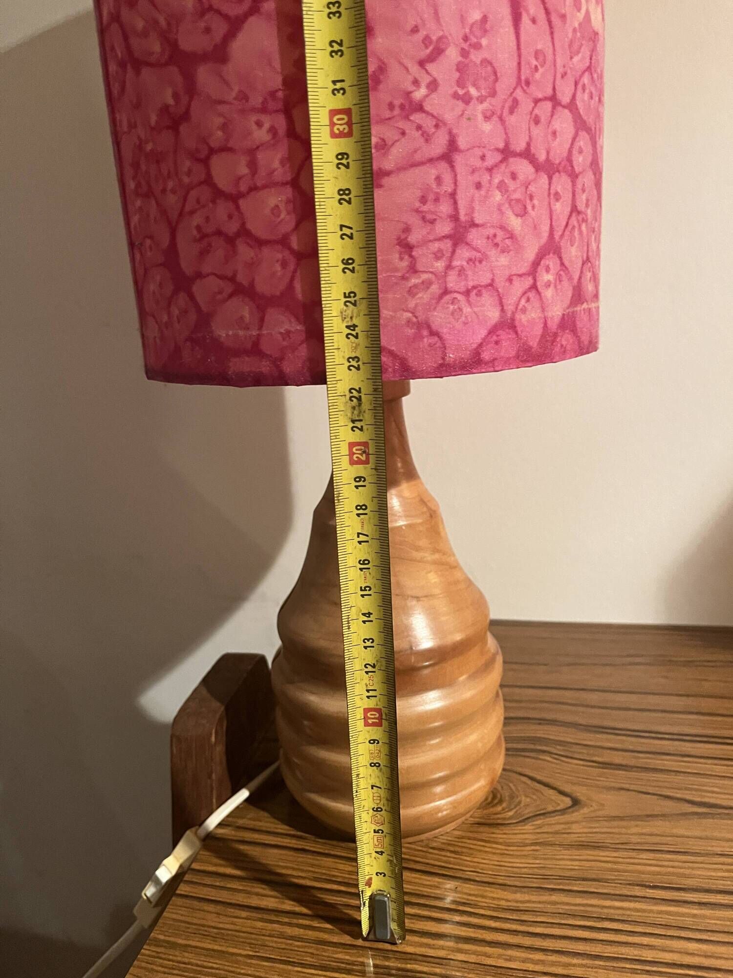 Vintage lamp with a carved wooden base from the 1970s.