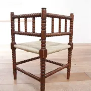Antique Dutch oak corner chair with turned spindles and new rush seat