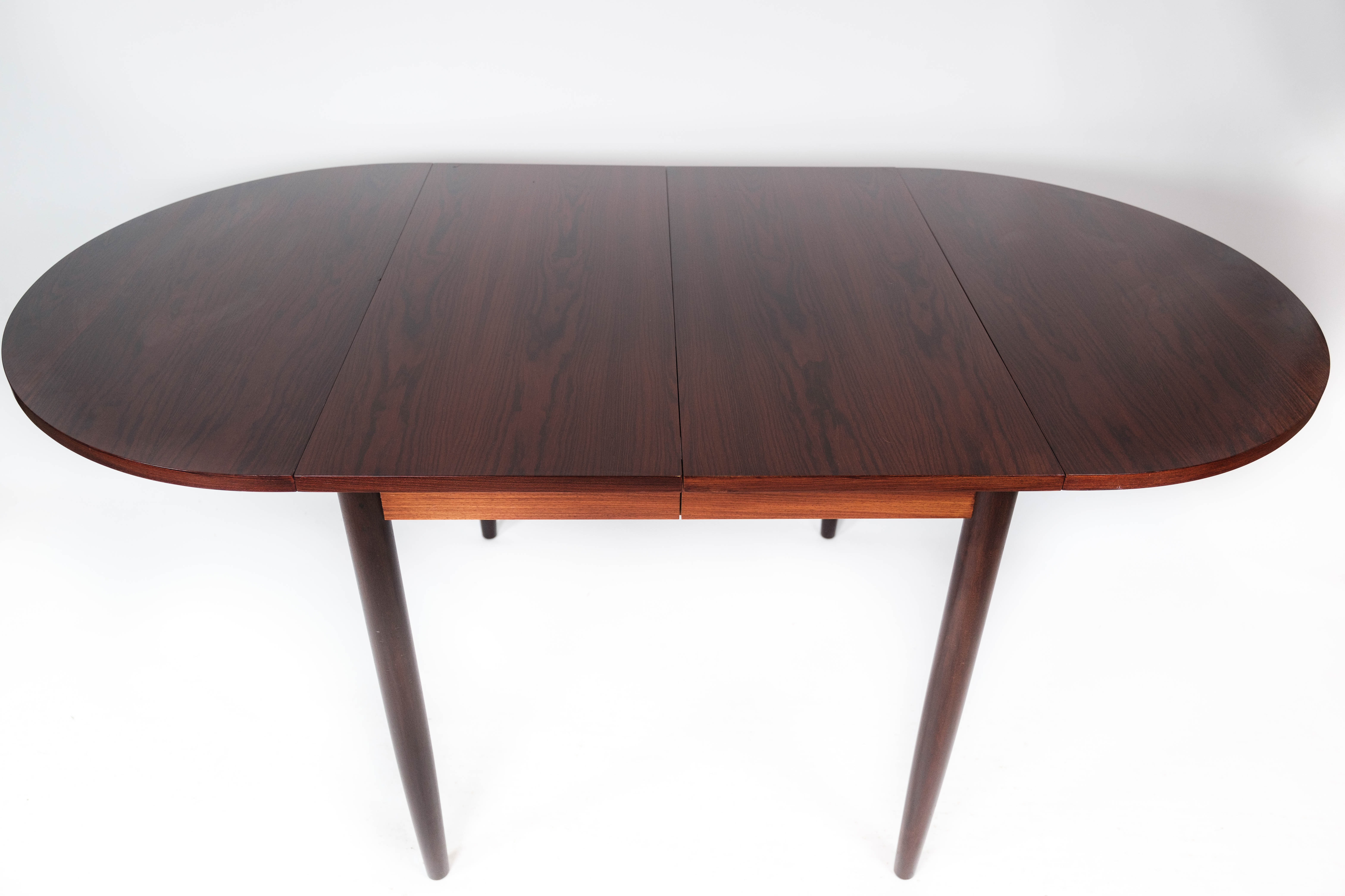 Dining table in rosewood with extension plates, designed by Arne Vodder, 1960s