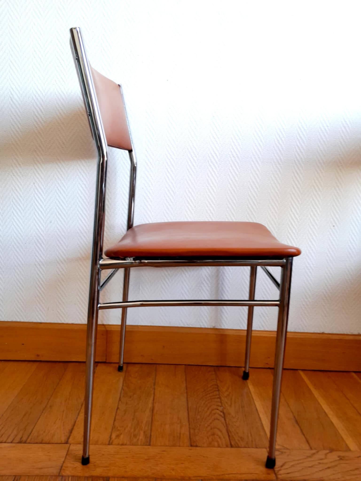 Three mid-century chairs in faux leather and chrome from the 1950s.