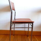 Three mid-century chairs in faux leather and chrome from the 1950s.