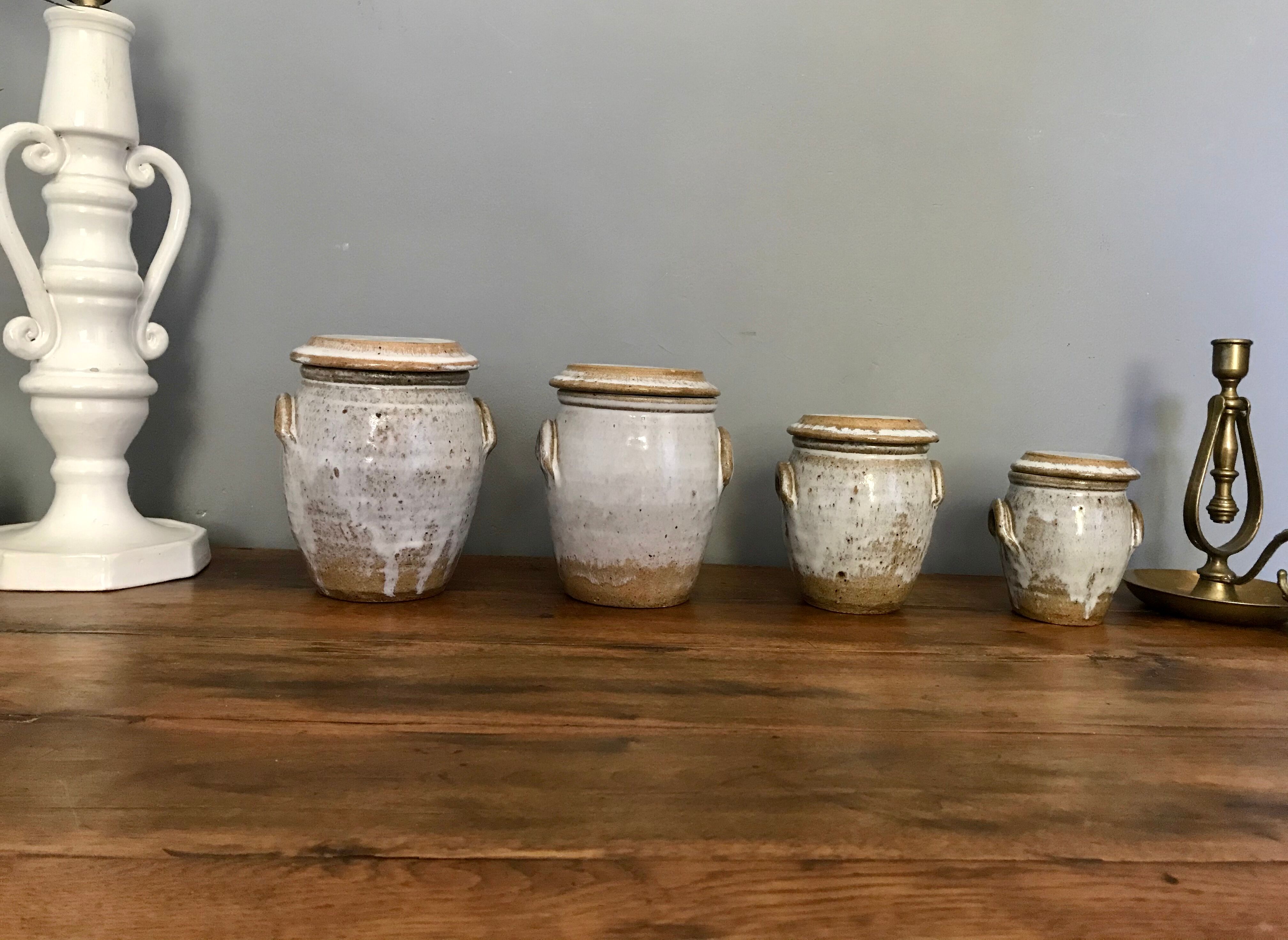Suite of antique enamelled ceramic pots