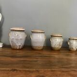 Suite of antique enamelled ceramic pots