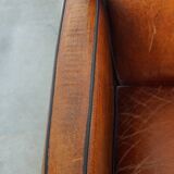 Sheepskin Art Deco design armchair with wood and beautiful cognac-colored leather