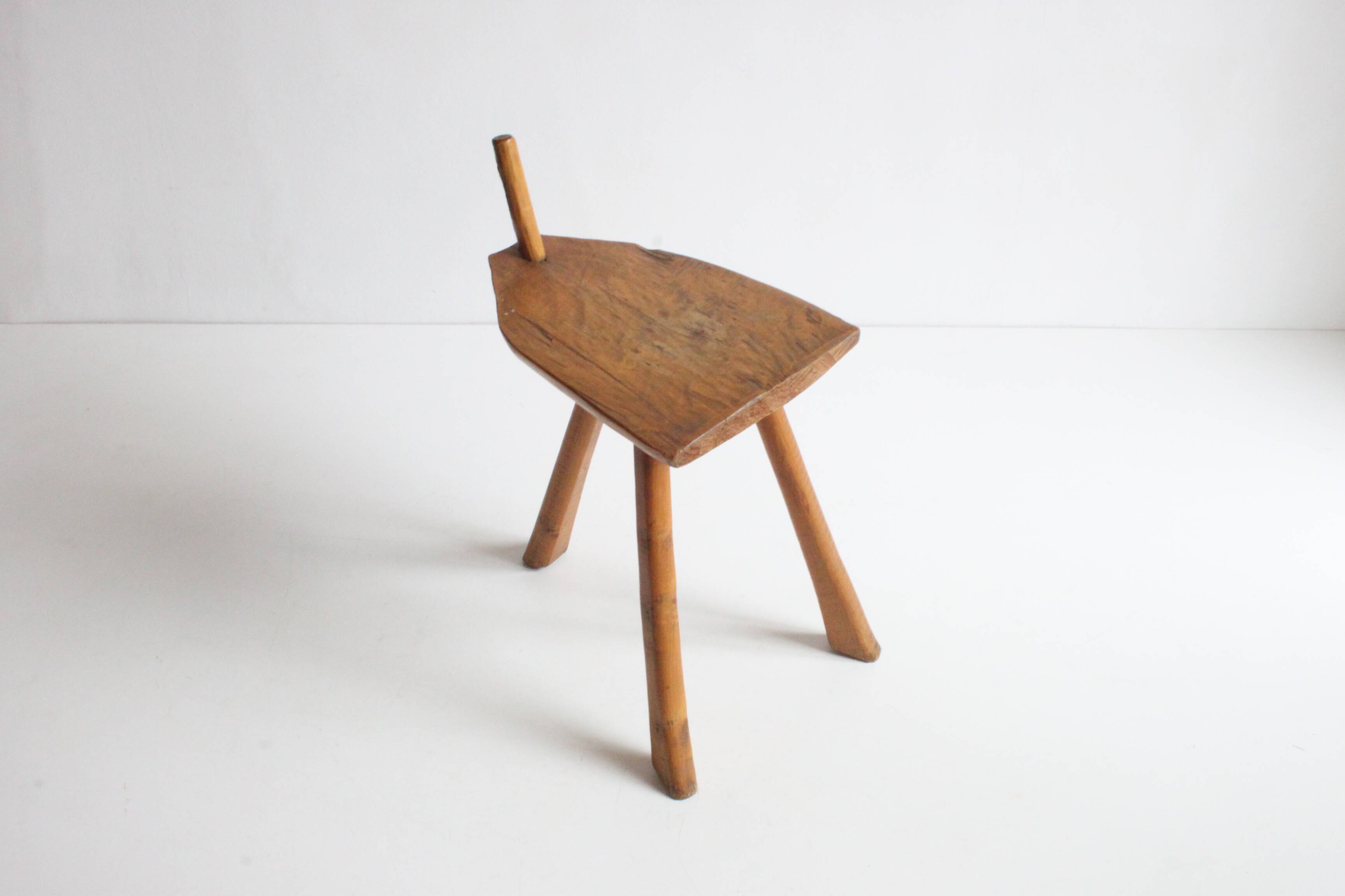 Brutalist tripod stool in carved wood, 1950s