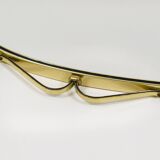 Elegant wall mirror in brass and black from the mid-century, Italy, 1950s.