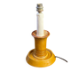 Candle holder-style lamp made entirely of ceramic.