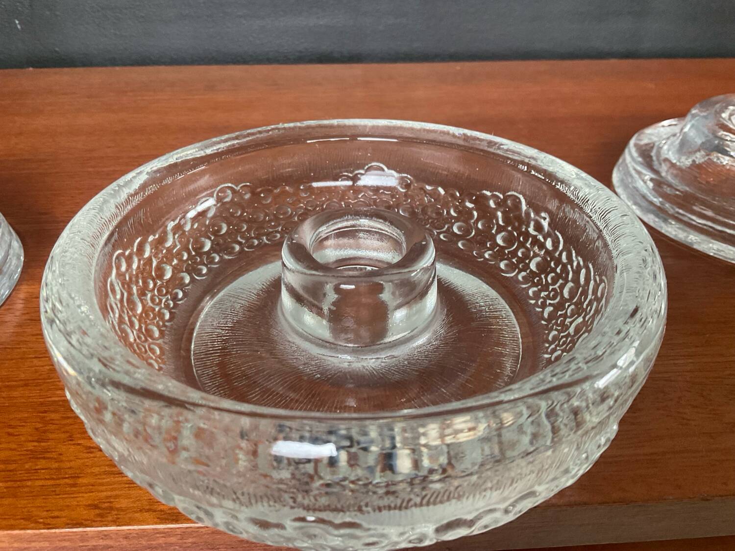 Set of three round thick moulded glass candle holders