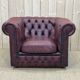 Chesterfield armchair in red leather from the 1980s
