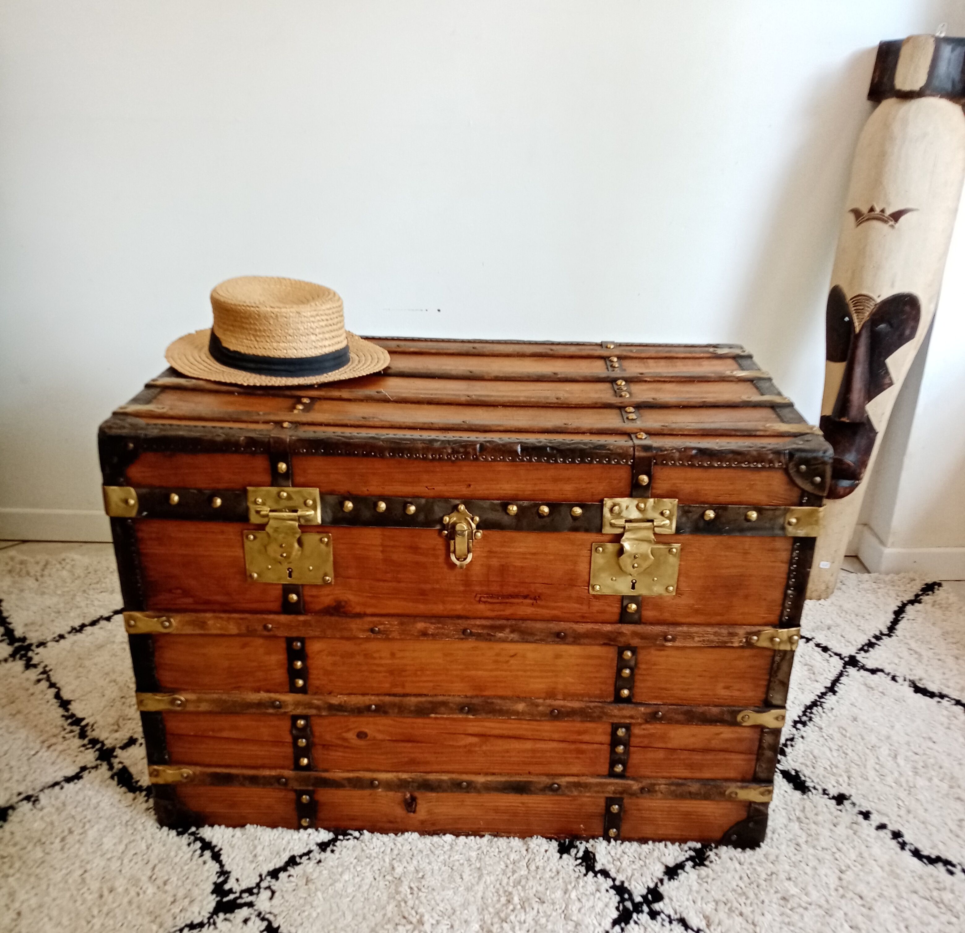 Restored varnished wooden antique travel trunk