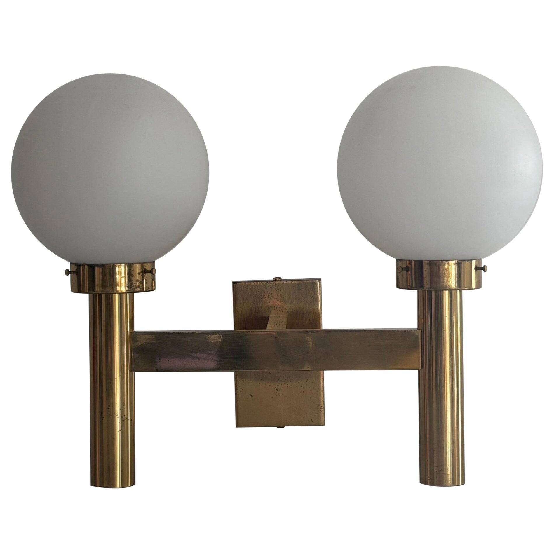 Double opal glass and heavy brass, large minimalist cinema wall light, 1960s, Germany