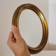 Miroir ovale cadre en bois doré 22 X 17 X 2 cm.