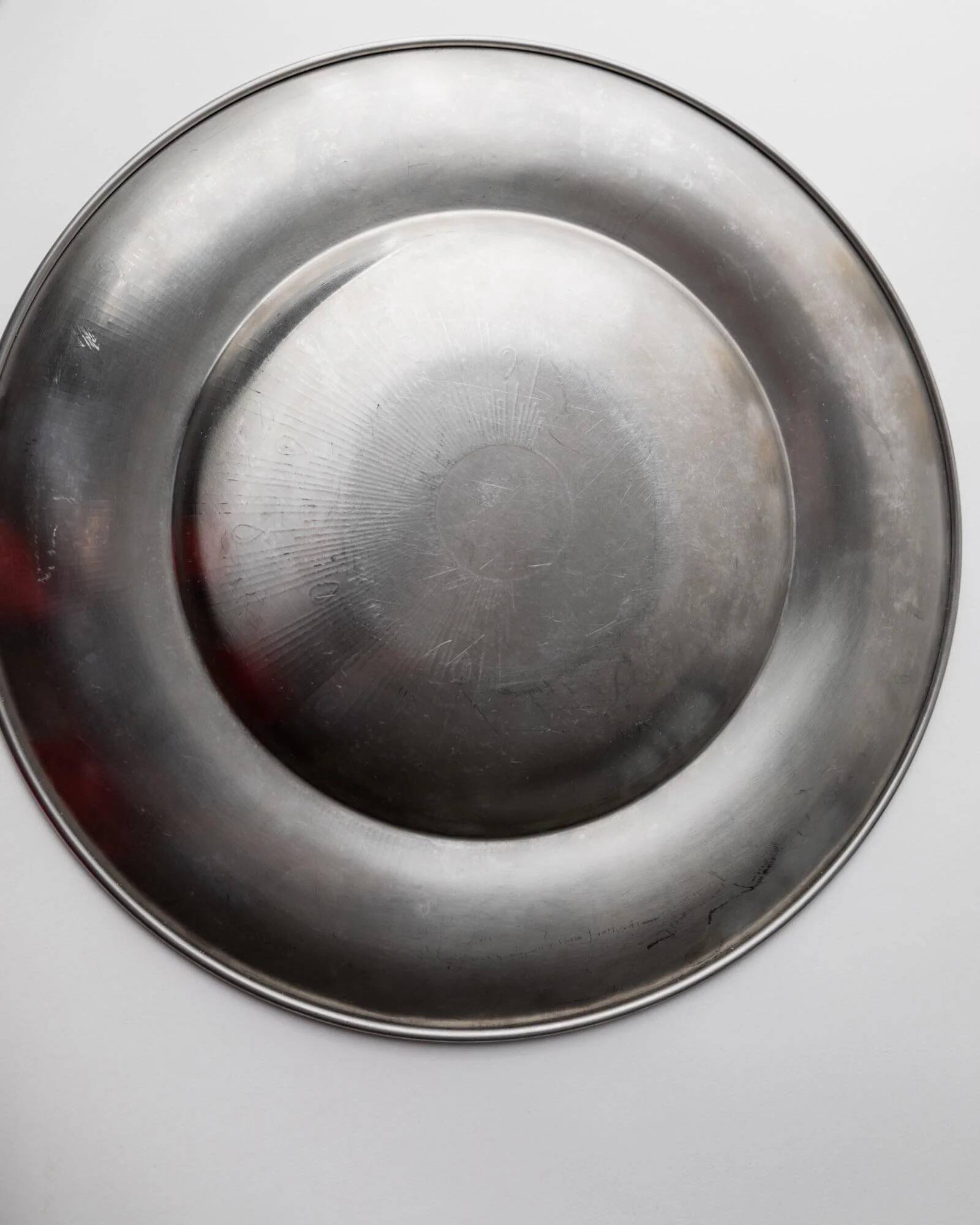 Vintage stainless steel bowl from the 1980s, polished metal with a finely textured surface, timeless elegant design, retro table decoration, noble gift idea.