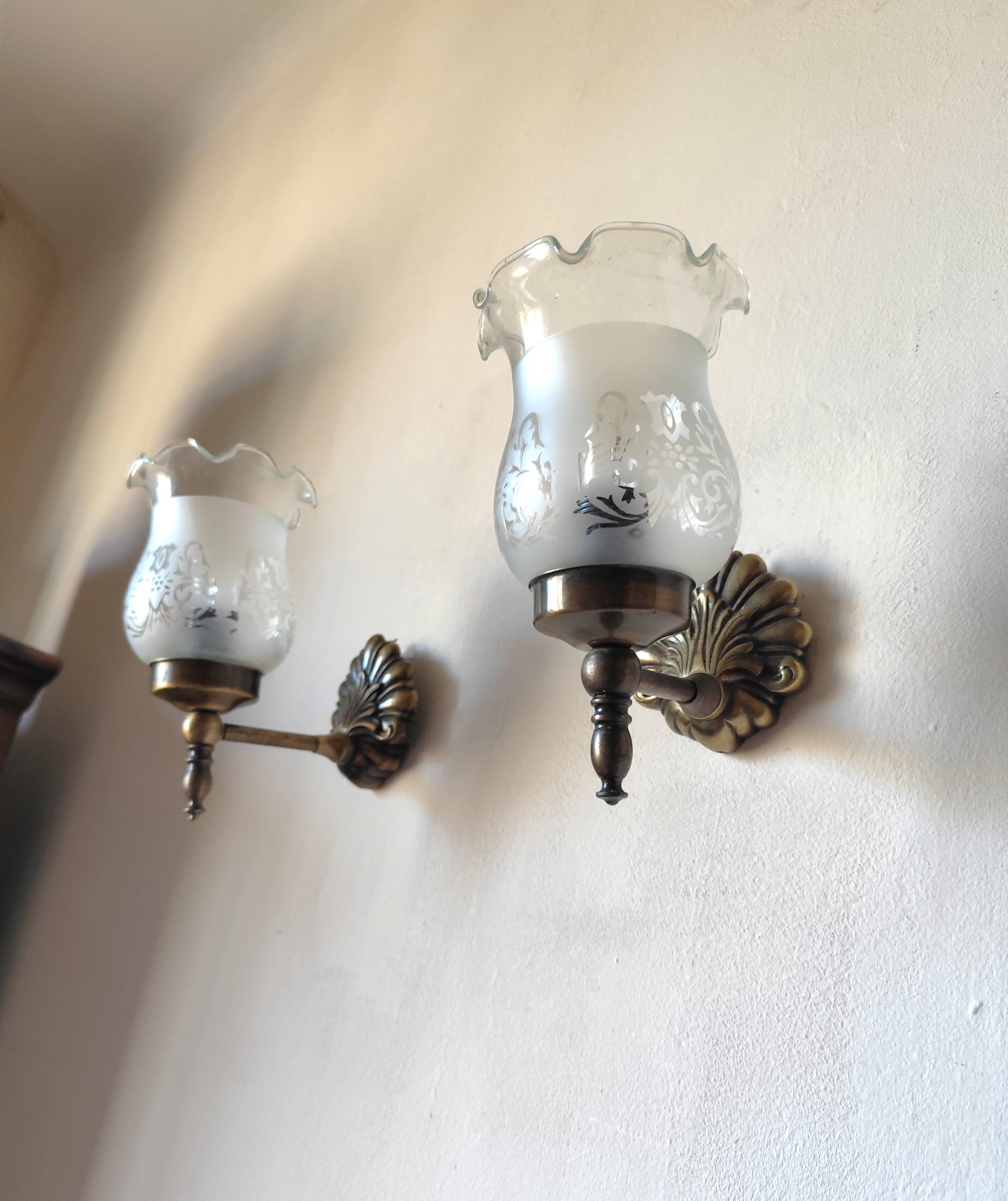 Pair of wall sconces in bronze with opaline glass tulips.