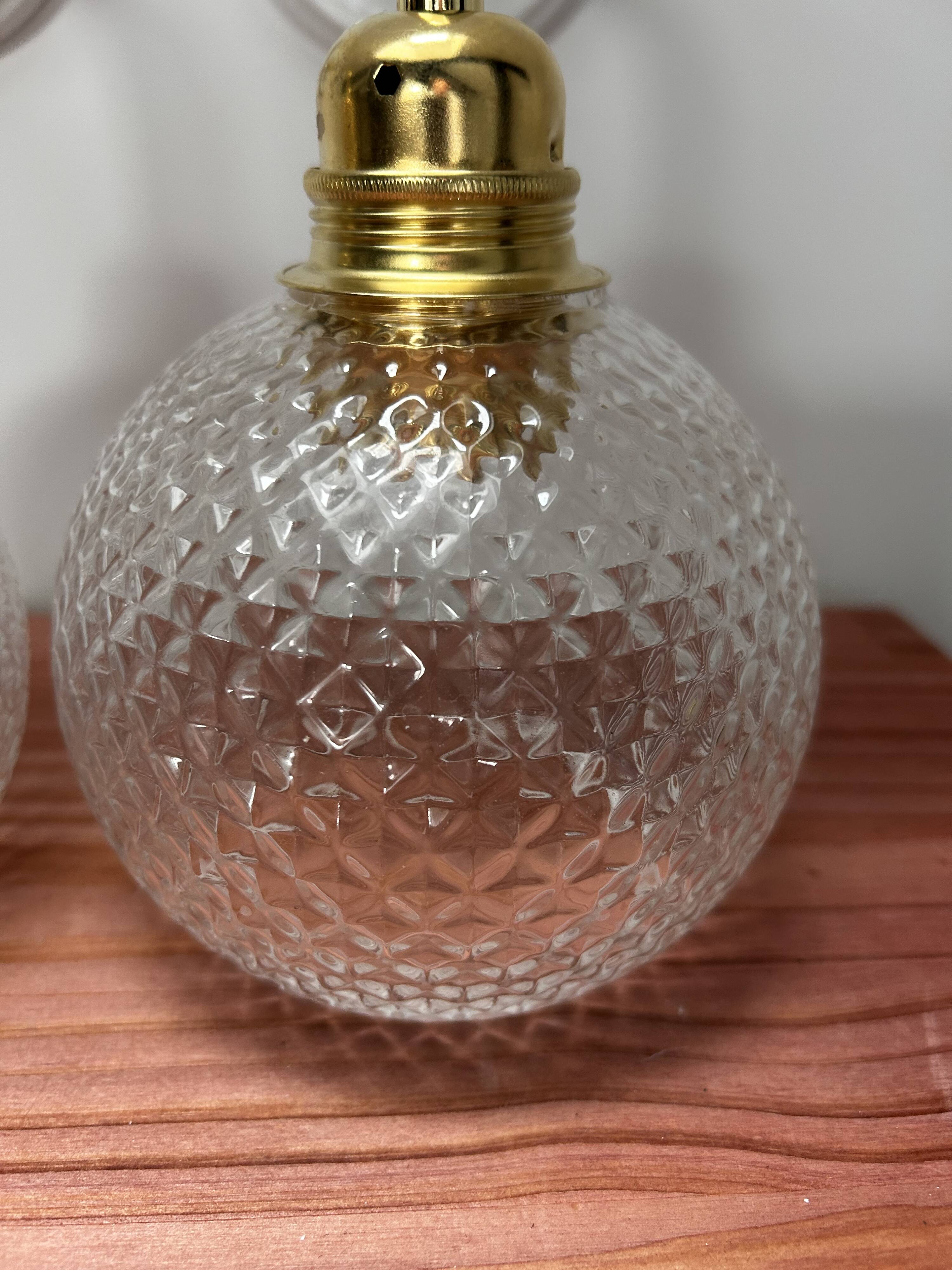 Pair of chiseled glass wall sconces