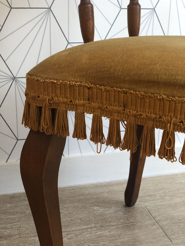 Vintage fringed gondola armchair