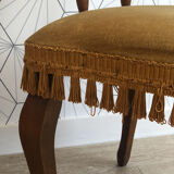 Vintage fringed gondola armchair