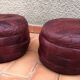 Pair of vintage poufs in burgundy leather patchwork, 1970