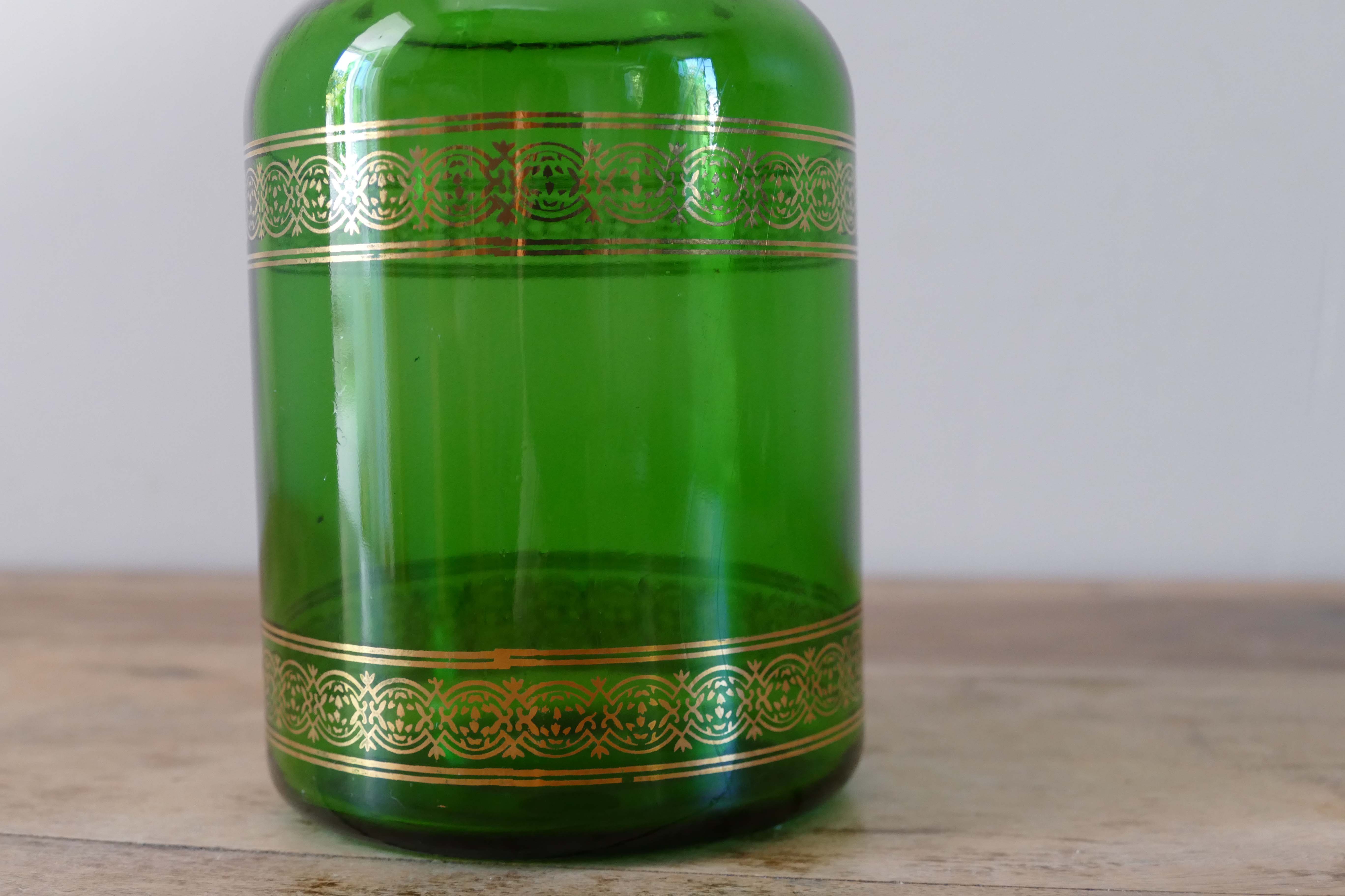 Green vintage apothecary pot and golden ledé