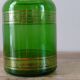 Green vintage apothecary pot and golden ledé