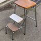 Folding stool in formica with a wood effect.